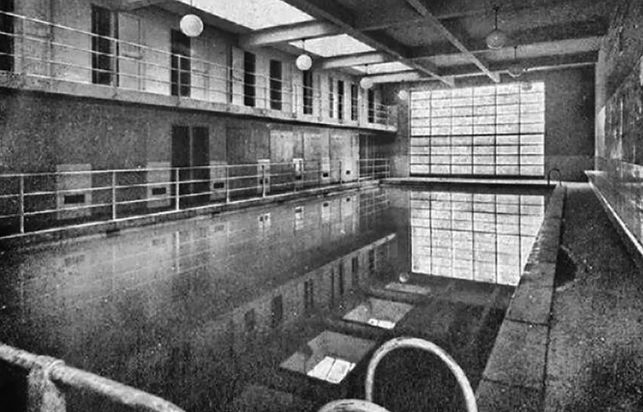 A historical image of the Popular Baths that occupied the premises before the gymnasium.